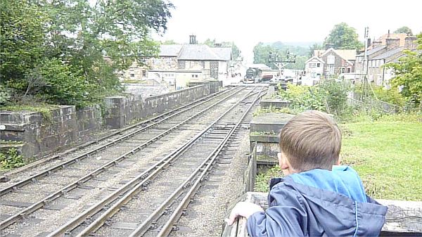 Waving at trains on the North Yorkshire Moors Railway.