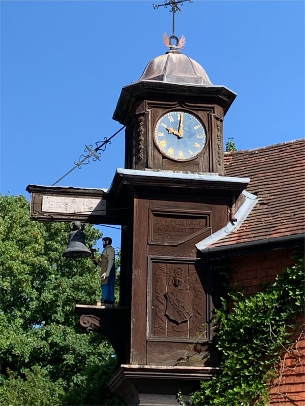 "Jack the Blacksmith" striking his clock on the hour.