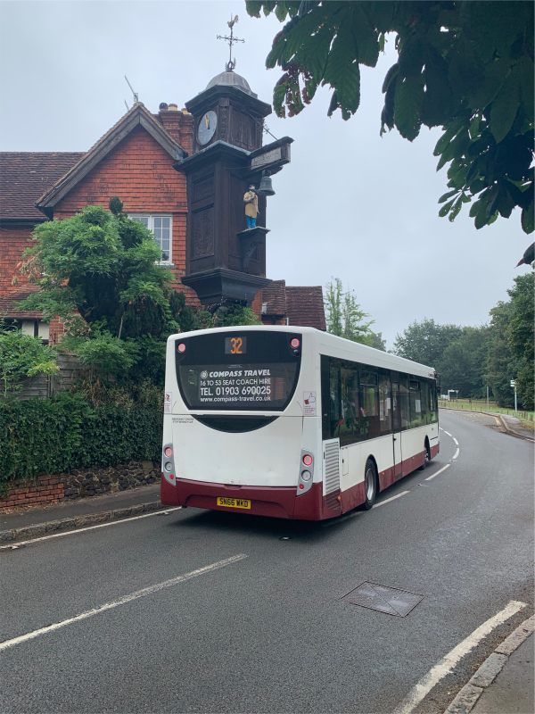 The clock has been hit by high sided vehicles once or twice. Thankfully the bus is a single decker. It's an amazing section of very windy, very picturesque A road. To widen it would destroy the village.