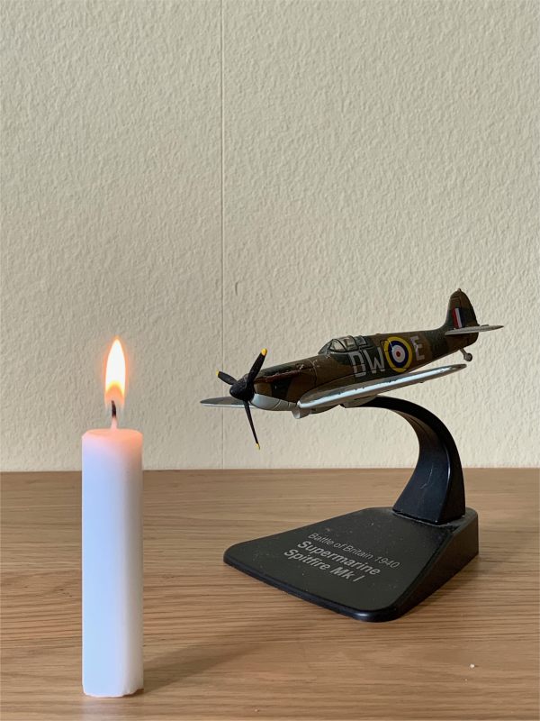 Model of a Supermarine Spitfire Mk I and a Candle Lit for Diddley.