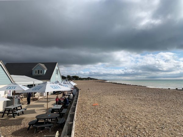 The Bluebird Café on Ferring Seafront, looking along the beach with the sea on the right.