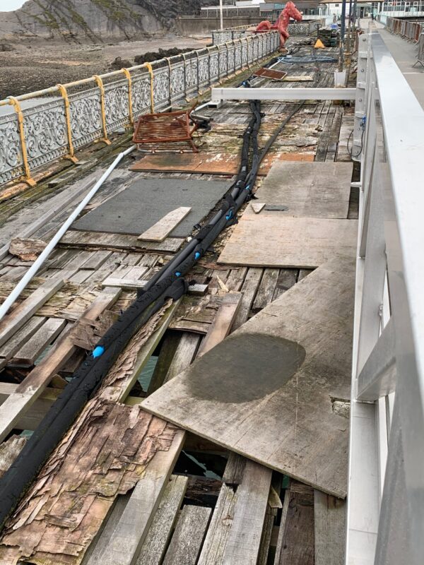 Old decking on Mumbles Pier in a very poor state of repair.