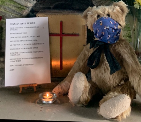 Bertie, wearing his face mask, in a church with a candle lit for Diddley. Alongside is a Corona Virus prayer: "Dear God, I pray for healing to all affected by this deadly virus. Only You can move in a mighty way and do the impossible for them. We pray for all negative outcome to be resolved by Your healing hands. Bless and cover each and every single person and bring whole to their bodies from the top of their head to the soles of their feet. Amen."