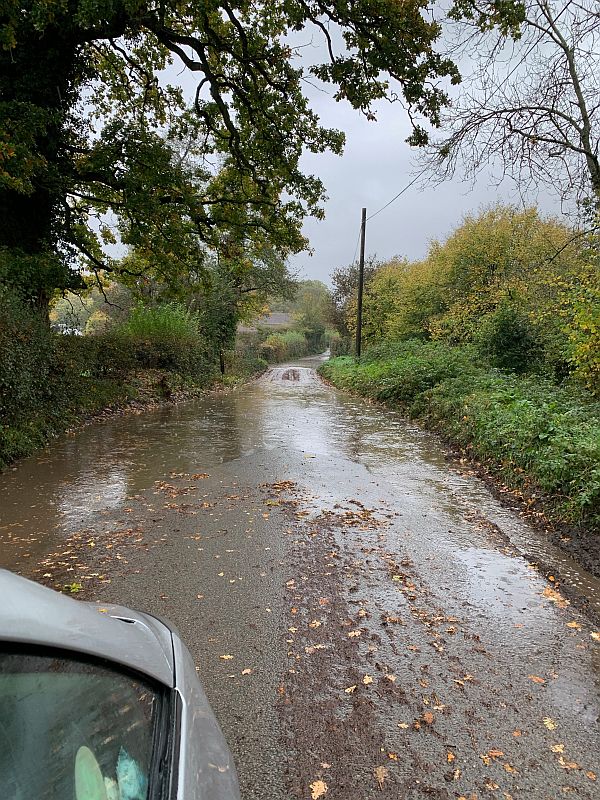 A flooded country lane. Further down, the River Tillingbourne had burst its banks.