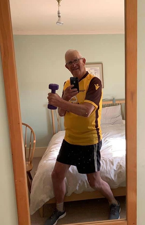 Bobby photographing himself in his bedroom mirror whilst exercising online.