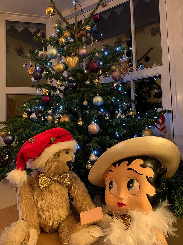 Betty & Bertie, with the Little Pink Book, in front of the decorated Christmas Tree.