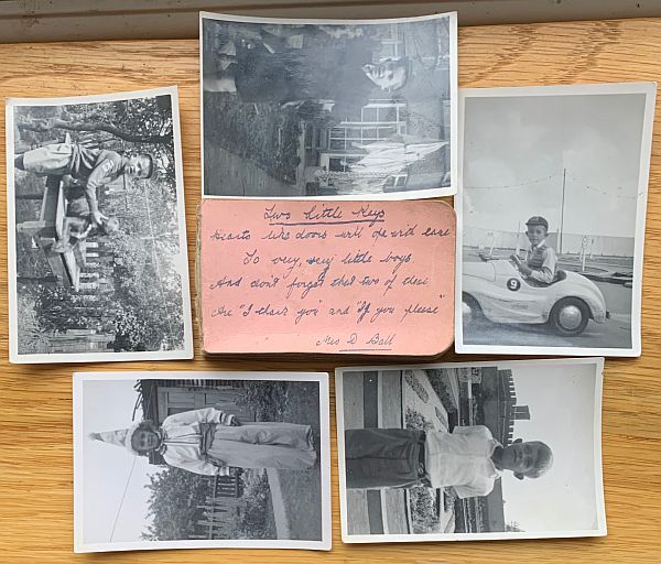 Family history photographs with a pink "Post It" note.