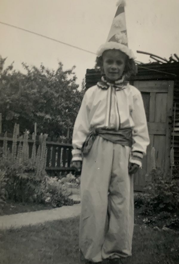 May 1953. The Coronation clown. Handmade by Dorothy, apart from the hat which came from Hamleys in Regent Street. Enhanced by ginger rug wool for the hair.