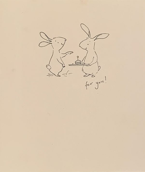 Two outlined cartoon hares, one offering a cup cake with a candle and saying "for you".