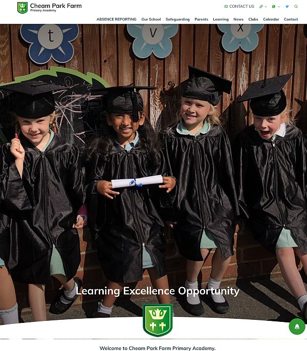 Publicity photograph for Cheam Park Farm Primary, with four students wearing caps and gowns and holding rolled certificates.