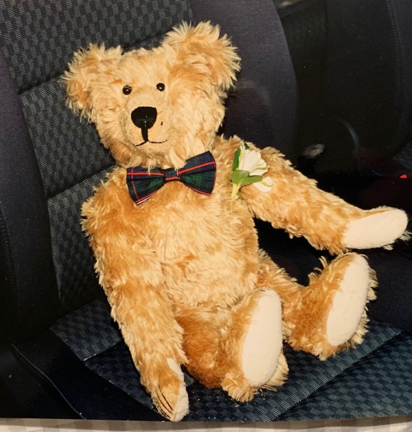 Bertie dressed as the Best Man sat in a seat in the car.