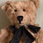 Headshot of Bertie wearing a black cravat.