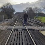 Bobby standing in the middle of the Railway Crossing looking south, towards Oakley.