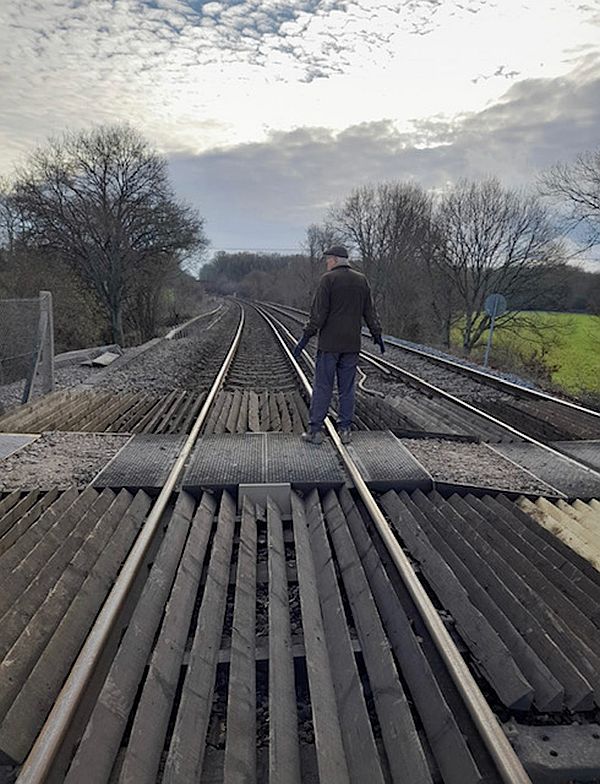 Bobby standing in the middle of the Railway Crossing looking south, towards Oakley.