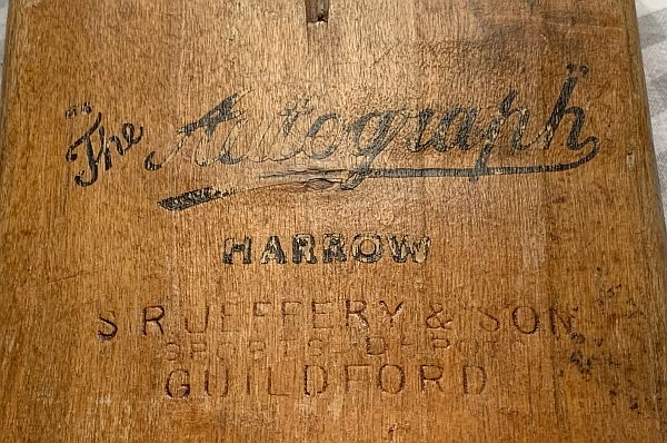 Close up of more detail: "The Autograph, Harrow" and "SR Jeffery & Son, Sports Depot, Guildford".