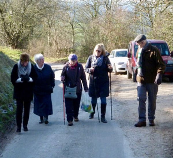 Bobby and four ladies walking up a road.