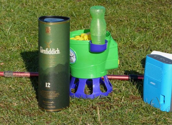 A box of Glenfiddich, a child's bubble machine and a portable radio.