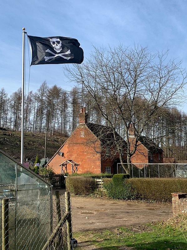 House in Wotton flying the Skull & Crossbones.