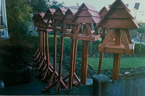 A large number of Bobby's wooden birdhouses ready to be delivered.