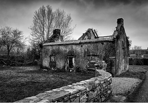 Black and white image of a derelict building.