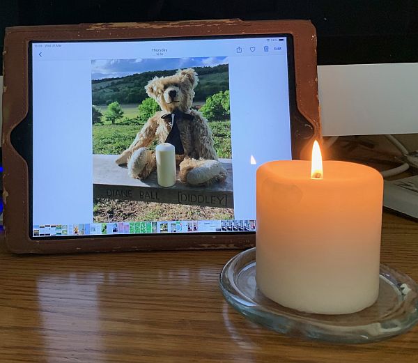 A candle lit for Diddley in front of a candle lit for Diddley in 2018.