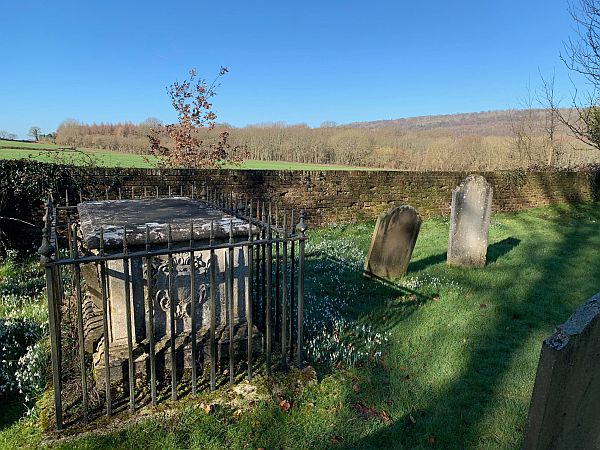 Tomb with iron railings around.