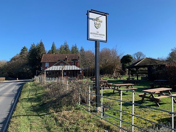 The Wotton Hatch pub. Close to the church on the A25.