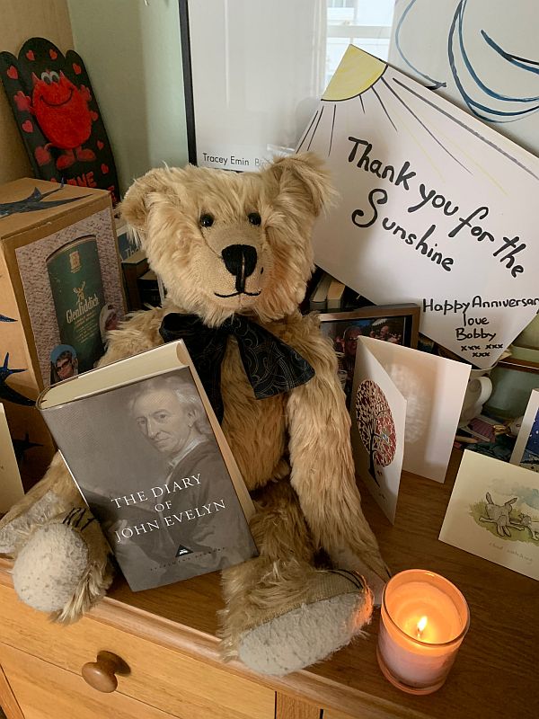 Bertie, a candle lit for Diddley and a copy of John Evelyn's diary.