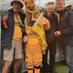 The Greatest Day for Sutton United: Bobby, Jenny (mascot, a giraffe), David, Andrew.