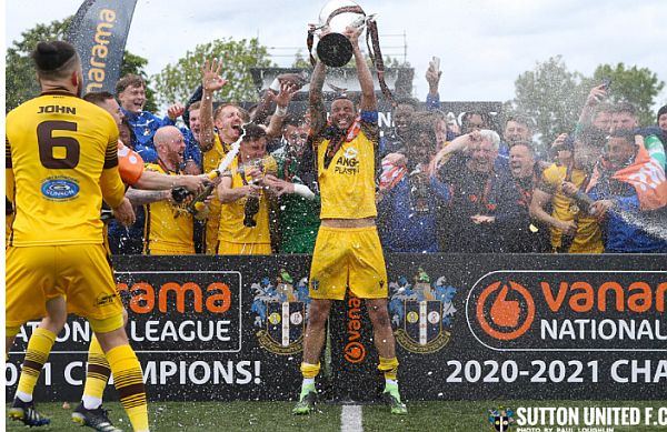 Players and fans of Sutton United celebrating their victory.
