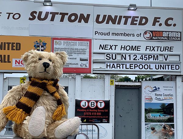 Bertie outside the entrance to Sutton United.