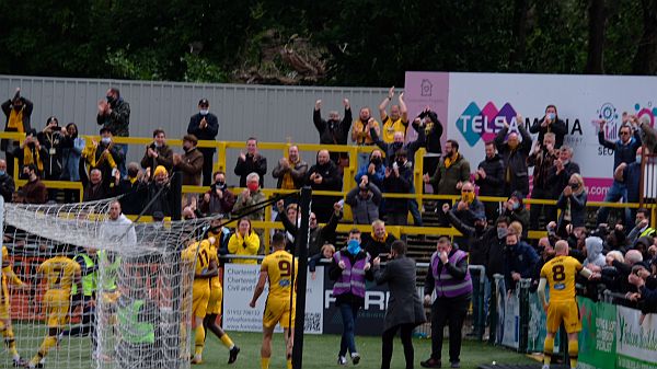 Players and fans celebrating the win.