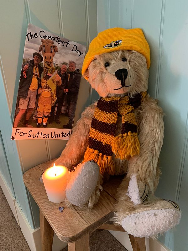 Bertie is his Sutton United strip with a candle lit for Diddley.