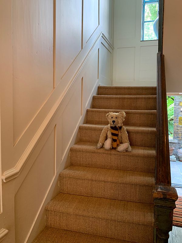 Bertie sat halfway down the stairs in 31 Fournier Street.