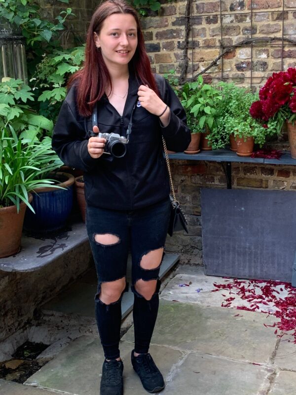 Amber with camera and blackholey trousers!