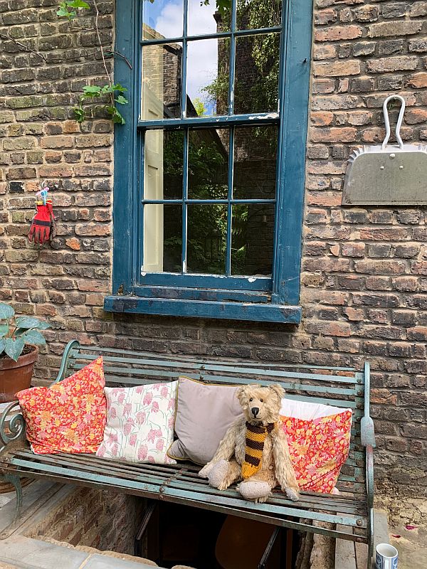 Bertie on a bench in the garden in 31 Fournier Street.