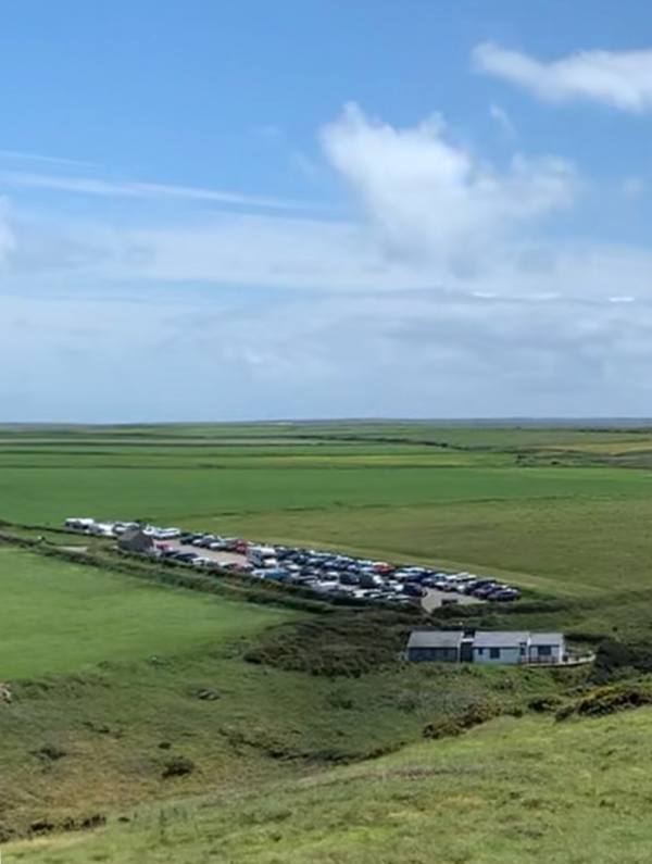 Marloes Peninsular. National Trust Car Park for day trips from Martin's Haven to Skomer. In front: Lockley Lodge.