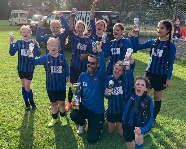 We won the cup! Worthing Town Ladies Under 12, with coach Andy.