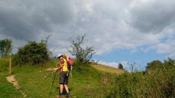 Photo of Bobby climbing Swift's Hill with Bertie in has rucksack!