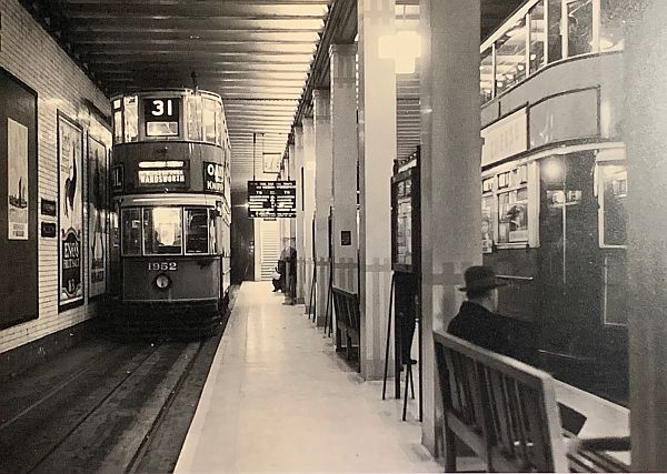 Two double-deck trams at Aldwych tram stop.