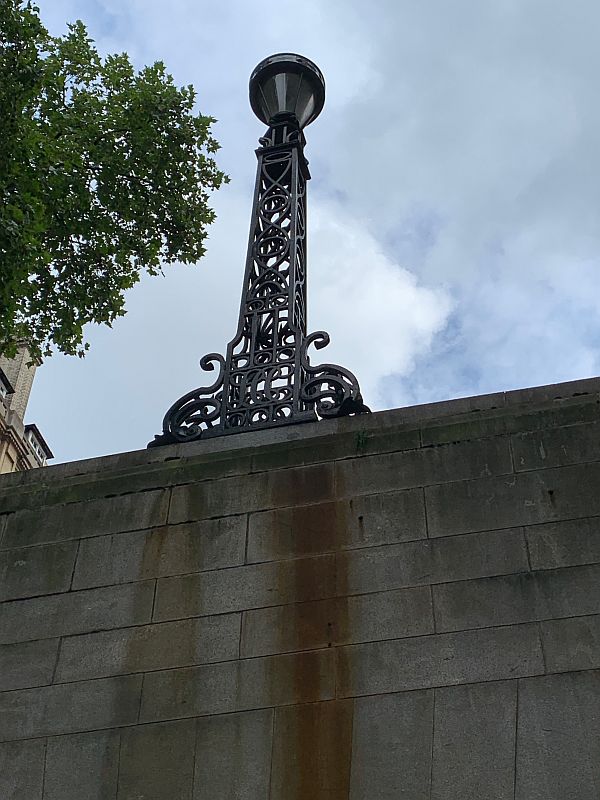 The original lamp standard from 1906 on the entrance wall to the Kingsway Tram Tunnel.