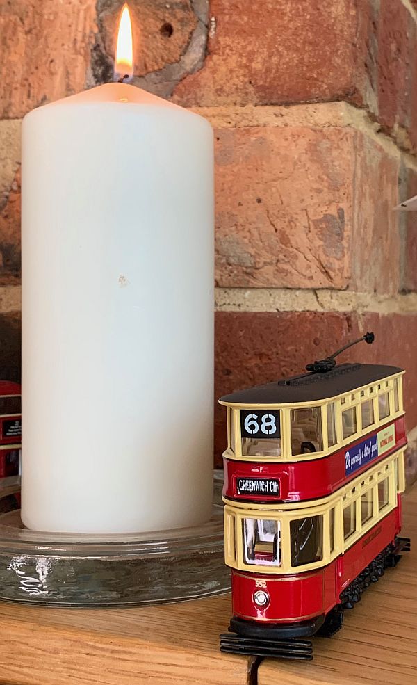 A candle lit for Diddley alongside Bobby's No68 tram 552.