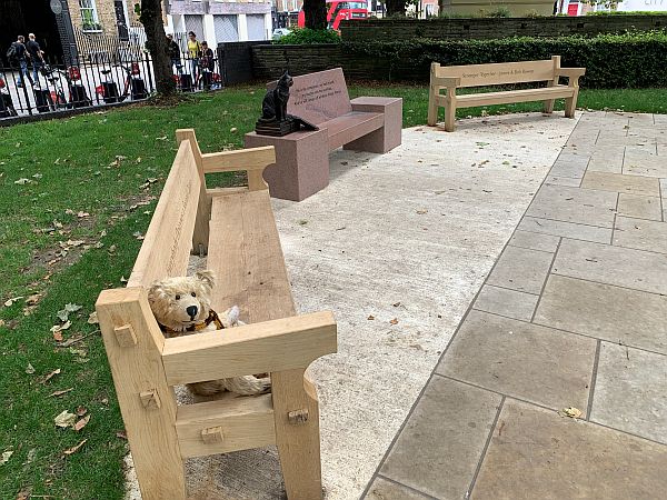 Bertie sat on a bench at the Islington Green Memorial to Bob.