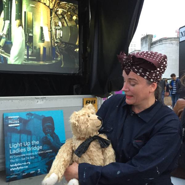 A lady in wartime clothing with Bertie at Ladies Bridge.