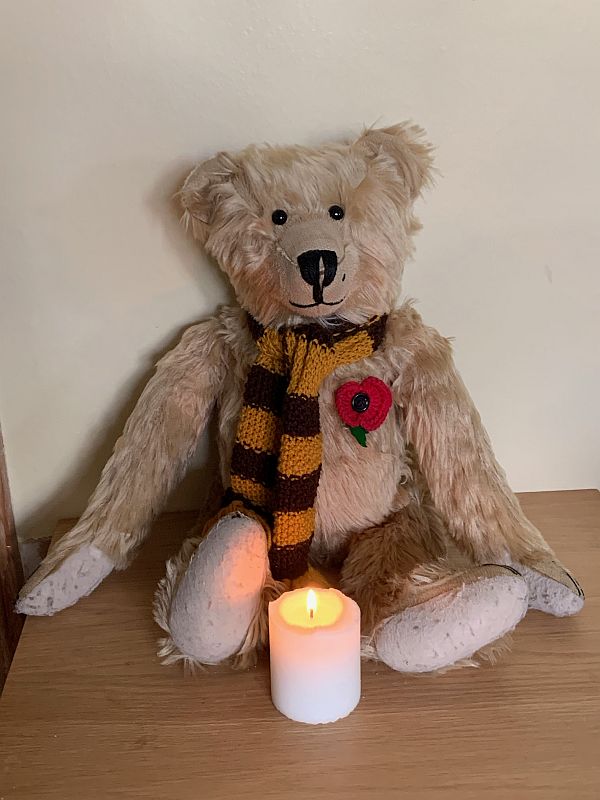 Bertie with a candle lit for Diddley in front of him.