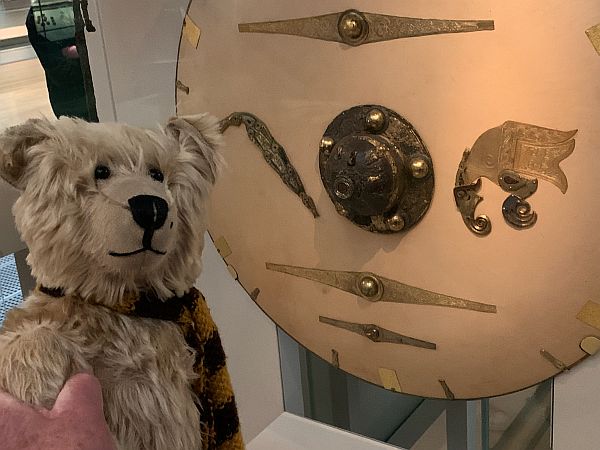 Bertie looking at the shield.