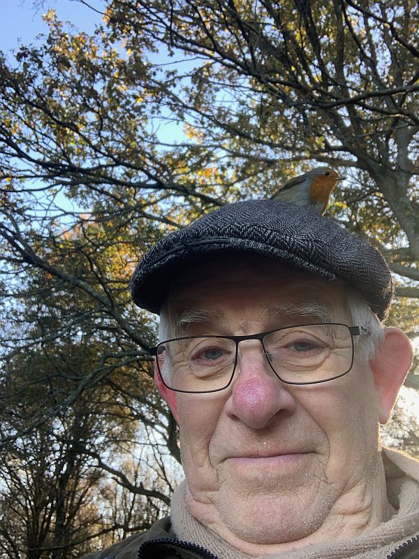 Bobby, wearing his cap with the Robin on top.