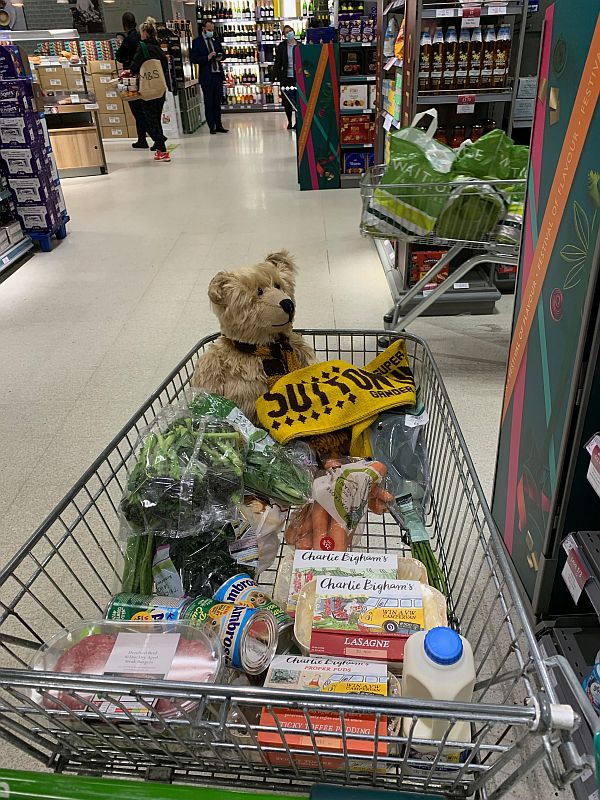 Bobby's shopping trolley in Waitrose - with Bertie amongs the shopping, including a load of "Charlie Bingham's" ready meals.