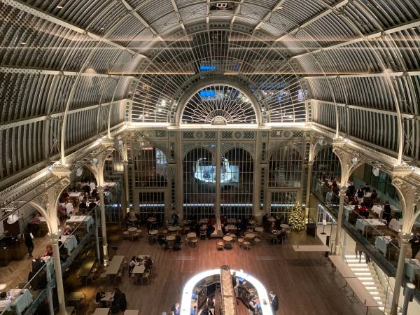 Room with a high-arched glass roof.