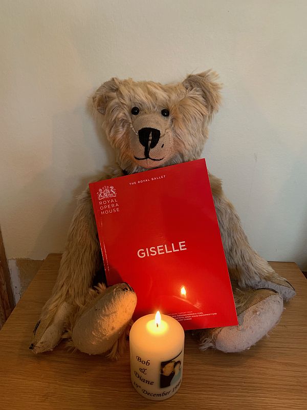 Bertie, with a copy of the programme from "Giselle", and a candle lit for Diddley.